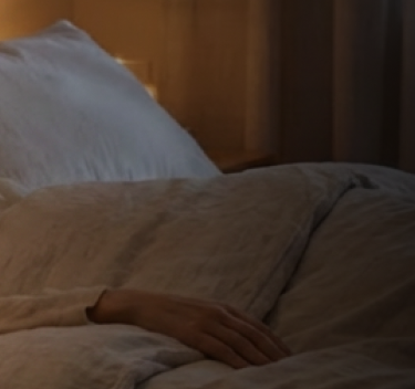 Person lying calmly in bed